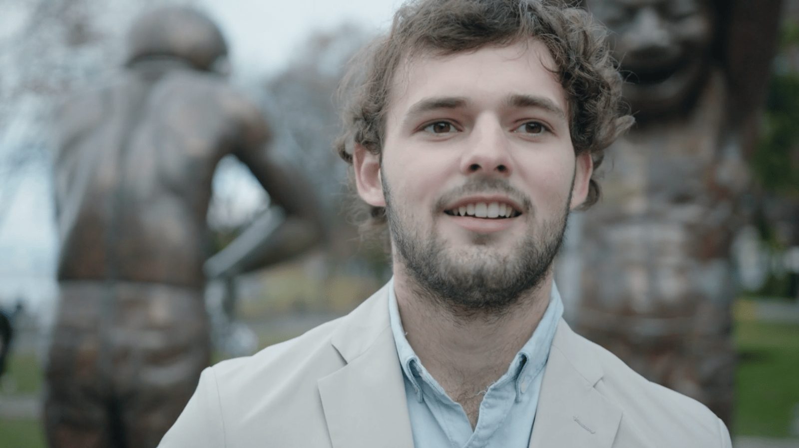 A young man smiling, from the HelloChat commercials